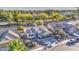 Aerial view of home with two-car garage, desert landscaping, and a nearby lake surrounded by mature trees at 835 W Beechnut Dr, Chandler, AZ 85248