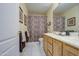 Well-lit bathroom with double sink vanity and patterned shower curtain at 835 W Beechnut Dr, Chandler, AZ 85248