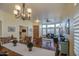 Dining room with views into the living room with wood flooring and elegant chandelier at 835 W Beechnut Dr, Chandler, AZ 85248