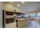 Spacious kitchen features dark cabinetry, stainless steel appliances, and granite countertops at 835 W Beechnut Dr, Chandler, AZ 85248