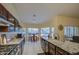 Well-lit kitchen with granite countertops, stainless steel appliances, and a cozy breakfast nook overlooking the backyard at 835 W Beechnut Dr, Chandler, AZ 85248