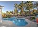 Beautiful backyard pool surrounded by lush trees and desert landscaping creating a private retreat at 835 W Beechnut Dr, Chandler, AZ 85248