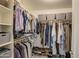 Organized walk-in closet with ample storage and shelving for clothes, shoes, and accessories at 835 W Beechnut Dr, Chandler, AZ 85248