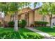 Attractive single-story home boasting a red tile roof, rounded windows, and verdant front lawn at 855 E Vaughn Ave, Gilbert, AZ 85234