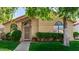 Inviting single-story home with arched windows, manicured bushes, and a secure front door entrance at 855 E Vaughn Ave, Gilbert, AZ 85234