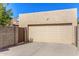 Garage door exterior, providing secure parking and storage space for vehicles and belongings at 855 E Vaughn Ave, Gilbert, AZ 85234