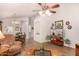 Bright living space with wood-look floors, ceiling fan and views of the dining area at 855 E Vaughn Ave, Gilbert, AZ 85234