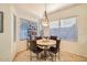 Cozy breakfast nook with a round table, four chairs, and lots of natural light from the windows at 8632 E Gail Rd, Scottsdale, AZ 85260