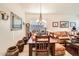 Cozy dining space featuring a dark wood table, neutral walls, and open layout to the living area at 8632 E Gail Rd, Scottsdale, AZ 85260