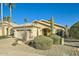 Beautiful home with a desert-themed yard featuring a variety of native plants and a tiled roof at 8632 E Gail Rd, Scottsdale, AZ 85260