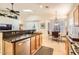 Well-lit kitchen featuring stainless steel appliances, granite countertops, and functional design at 8632 E Gail Rd, Scottsdale, AZ 85260