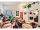 Comfortable living room showing a sitting area with bright plants and lots of natural light at 8632 E Gail Rd, Scottsdale, AZ 85260