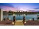 Scenic waterfront view with a private dock, stylish lighting, and a tranquil ambiance for lakeside relaxation at 9019 W Acoma Dr, Peoria, AZ 85381