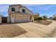 Charming two-story home with a spacious driveway, well-maintained landscaping and inviting curb appeal at 9019 W Acoma Dr, Peoria, AZ 85381