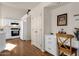 Bright kitchen features white cabinets, matching appliances, and a breakfast nook with a wooden floor at 9019 W Acoma Dr, Peoria, AZ 85381