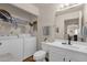 Laundry room featuring a washer, dryer, utility sink, and storage shelves at 9019 W Acoma Dr, Peoria, AZ 85381