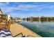 View of a backyard waterfront dock and relaxing lake view from the backyard at 9019 W Acoma Dr, Peoria, AZ 85381