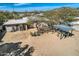 Aerial view of the backyard featuring a covered patio area and low-maintenance landscaping at 9031 N 14Th St, Phoenix, AZ 85020