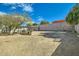 Expansive backyard with mature trees, a covered patio, and potential for customization at 9031 N 14Th St, Phoenix, AZ 85020