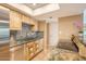 Bright kitchen with granite countertops, stainless steel appliances, wood cabinets, and tile flooring at 9031 N 14Th St, Phoenix, AZ 85020