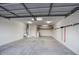 Spacious garage with ample storage, overhead lighting, and epoxy flooring at 9543 W Donald Dr, Peoria, AZ 85383