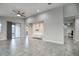 A spacious living room features tile floors, recessed lighting, and sliding glass doors to a patio at 9543 W Donald Dr, Peoria, AZ 85383