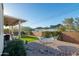 Inviting backyard featuring a hammock, artificial turf, and mountain views, perfect for relaxation and enjoying the outdoors at 10142 E La Palma Ave, Gold Canyon, AZ 85118