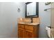 Powder room featuring vessel sink with granite counters and tile backsplash at 10142 E La Palma Ave, Gold Canyon, AZ 85118