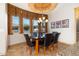 Dining area featuring mountain view windows and stylish black leather chairs at 10142 E La Palma Ave, Gold Canyon, AZ 85118
