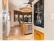 Dining area with tile floors, modern light fixture, stainless steel refrigerator, and view of the outside at 10142 E La Palma Ave, Gold Canyon, AZ 85118