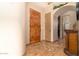 Front entryway with tile floors, decorative medallion, and wooden door at 10142 E La Palma Ave, Gold Canyon, AZ 85118