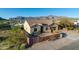 Charming single-story home with stucco exterior, tile roof, desert landscaping and mountain views at 10142 E La Palma Ave, Gold Canyon, AZ 85118