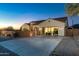 Charming single-story home featuring a three-car garage, well-maintained landscaping, and desert mountain views at 10142 E La Palma Ave, Gold Canyon, AZ 85118
