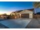 Charming single-story home featuring a three-car garage, well-maintained landscaping, and desert mountain views at 10142 E La Palma Ave, Gold Canyon, AZ 85118