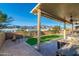 Inviting covered patio area with comfortable seating and views of surrounding desert landscape at 10142 E La Palma Ave, Gold Canyon, AZ 85118