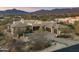 A sweeping aerial view showing the beautiful desert home and landscape at 10238 E Rising Sun Dr, Scottsdale, AZ 85262