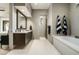 Bathroom features a soaking tub, a walk-in shower, and a large vanity at 10238 E Rising Sun Dr, Scottsdale, AZ 85262