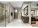 Bathroom has a single vanity with modern fixtures and a large walk-in shower at 10238 E Rising Sun Dr, Scottsdale, AZ 85262