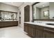 This bathroom features dual vanities, with modern hardware and a spacious layout at 10238 E Rising Sun Dr, Scottsdale, AZ 85262