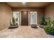 Beautiful entrance with a modern door and potted cactus at 10238 E Rising Sun Dr, Scottsdale, AZ 85262