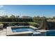 Relaxing hot tub with stone accents, surrounded by lush greenery and offering privacy and tranquility at 10238 E Rising Sun Dr, Scottsdale, AZ 85262
