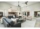 Bright living room with a stylish grey sofa set and plush white area rug at 10238 E Rising Sun Dr, Scottsdale, AZ 85262