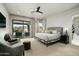Bright and airy main bedroom with large windows, a comfortable seating area, and desert views at 10238 E Rising Sun Dr, Scottsdale, AZ 85262