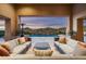 Inviting outdoor living space with comfortable seating and a beautiful pool view at 10238 E Rising Sun Dr, Scottsdale, AZ 85262