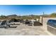 Elegant patio with outdoor seating, built-in grill, and lush desert landscaping, perfect for entertaining at 10238 E Rising Sun Dr, Scottsdale, AZ 85262