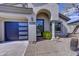 Inviting home entrance featuring desert landscaping and a Vivint security system at 10262 E Jasmine Dr, Scottsdale, AZ 85255