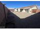 This backyard has gravel landscaping and a covered patio at 10402 N Balboa Dr, Sun City, AZ 85351