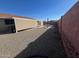 Wide shot of a backyard with gravel, a seating area, and a covered patio area at 10402 N Balboa Dr, Sun City, AZ 85351