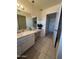 This bathroom features a vanity and a window at 10402 N Balboa Dr, Sun City, AZ 85351