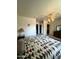 This bedroom features a ceiling fan and walk-in closet at 10402 N Balboa Dr, Sun City, AZ 85351
